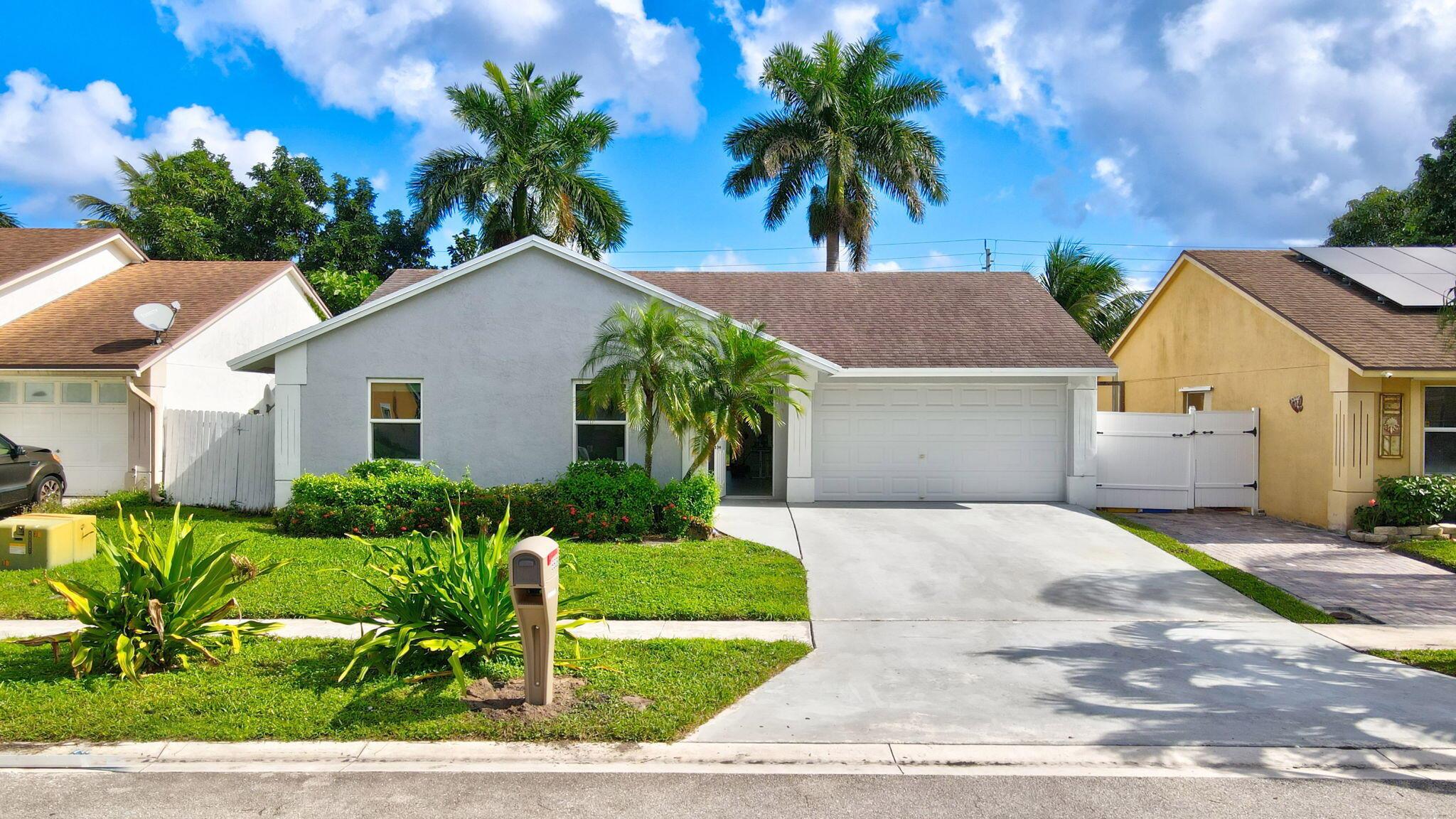 This delightful 3BR/2BA single family home, recently updated, offers a blend of comfort and practicality. Features include a modern kitchen with quartz countertops, new Samsung appliances, and easy-to-maintain porcelain tiles. Enjoy peace of mind with new impact-resistant windows and doors. The backyard's fruit trees provide a natural retreat. Perfect for families seeking a tranquil yet convenient lifestyle.