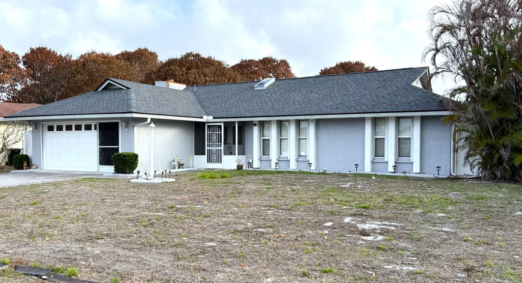 Photo of 1010 SE Damask Avenue, Port Saint Lucie, FL 34983 (MLS # B26005419)