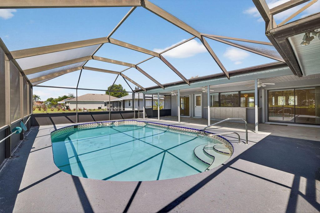 Photo of 1010 SE Damask Avenue, Port Saint Lucie, FL 34983 (MLS # B26005419)