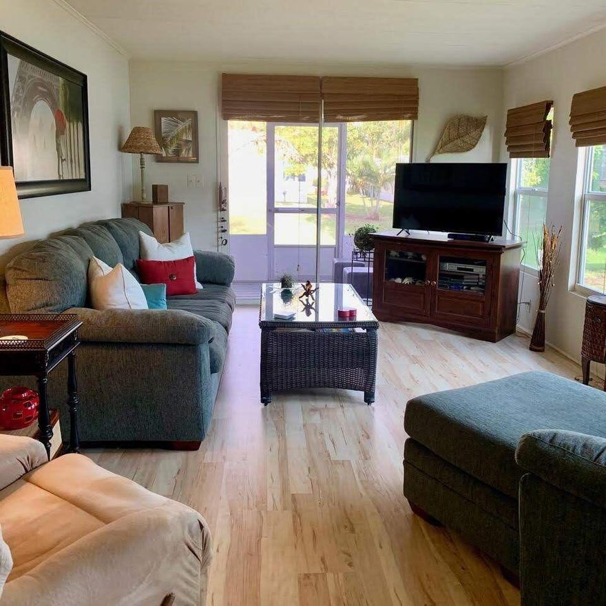 Turn-key DOUBLE WIDE 2 Bed/2 Bath, beautifully furnished home in an active 55+ community. Priced to SEll! Den doubles as an extra room/office. Well-maintained with 2019 roof, 2018 AC, 2023 vents, 2025 power-washed & painted driveway, and new kitchen floor. Nestled in a warm, friendly neighborhood where neighbors host parades, dances & dinners. Close-knit street with true community feel. PRIME location--15 min to the beach, NO flood zone, near grocery, bank, pharmacy & more. Lot lease $899.25 includes lawn care, trash, free private golf course, heated pool, gym, cards, pickleball, tennis, bocce & more!