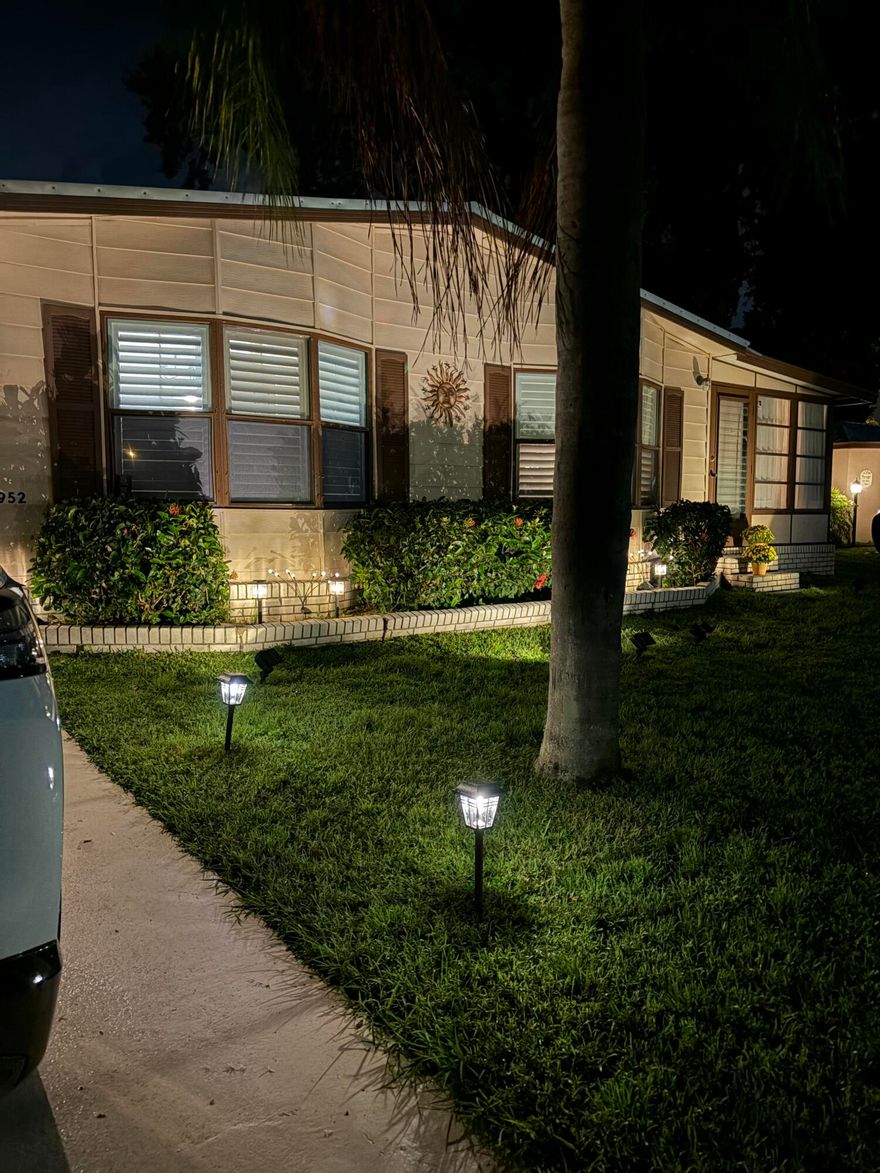 Lovely 2-bedroom 2-bath home in the 55+Spanish Lakes Fairways community. Home sits on a very quiet cal da sac street located at the beginning of the park. The home has carpet, tile, and laminate floors. Metal roof installed in 2025, A/C installed in 2021. The kitchen is open, with a bar/kitchenette. Refrigerator and Dishwasher are 2025. The laundry room is inside the home. The home has plantation shutters throughout. Lovely lania with windows and an A/C unit for enjoying morning coffee or evening cocktails. The land lease includes lawn maintenance, trash removal, and golf. The community features two pools, tennis, pickleball, bocce ball, shuffleboard, groups, social activities, billiards, cards, and a longevity center for working out. Motivated Seller! Bring us an offer.