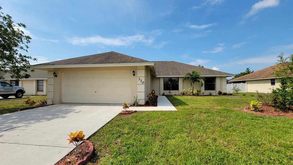 Photo of 330 SE Inwood Avenue Ave, Port Saint Lucie, FL 34984 (MLS # R10813103)