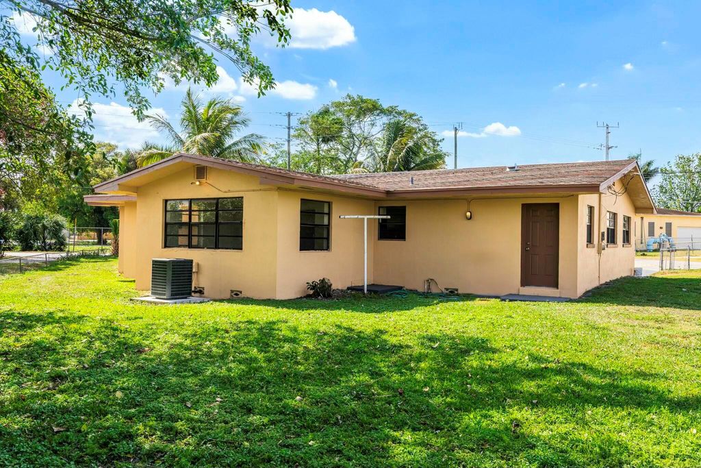 Photo of 349 NW 10th Street, Belle Glade, FL 33430 (MLS # R11072065)