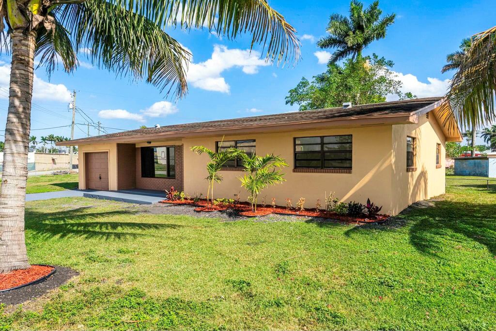 Photo of 349 NW 10th Street, Belle Glade, FL 33430 (MLS # R11072065)