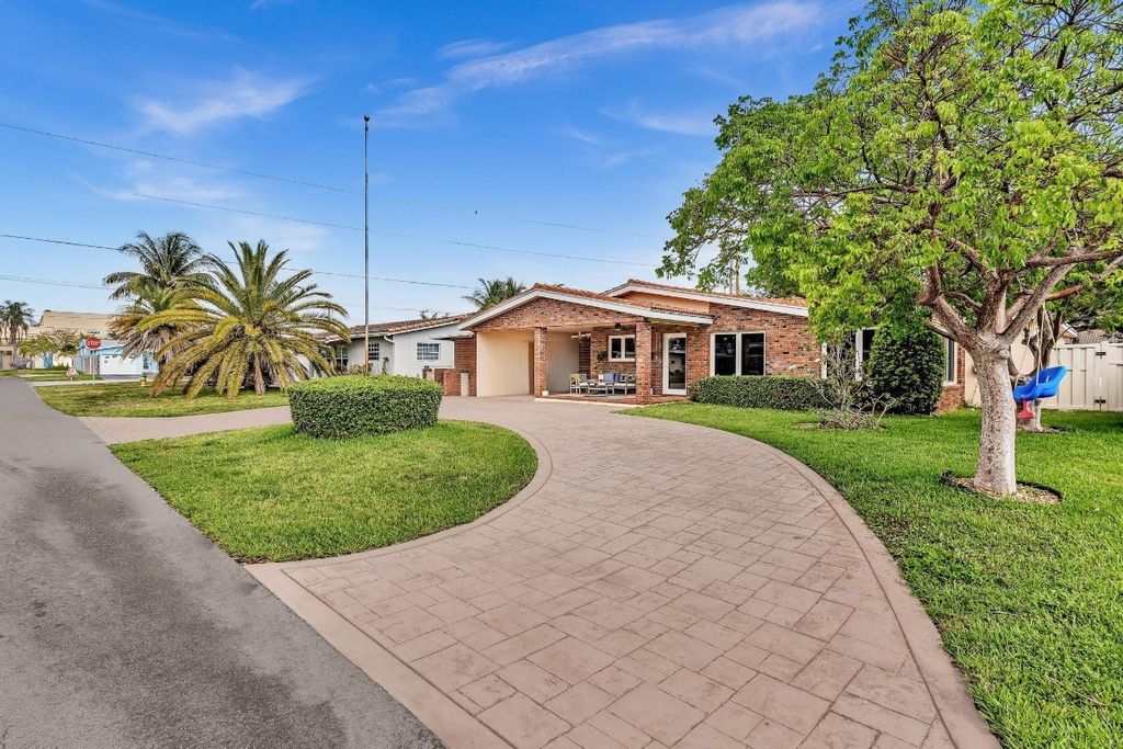 Photo of 1311 NE 42nd Street, Oakland Park, FL 33334 (MLS # F10504952)