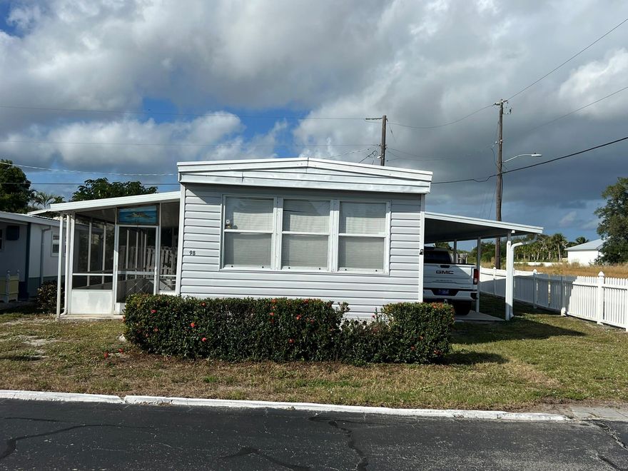 Charming 2 bedroom, 2 bathroom mobile home in the 55+ community of Sea Breeze.  Conveniently located between US1 (Federal Highway) and A1A, this home has a 12x40 carport, 9x33 screened-in porch and 8x10 shed.  Conveniently located close to shopping, library and the post office, offering both comfort and accessibility.  Nature lovers will appreciate being near Jonathan Dickinson State Park and Hobe South National Wildlife Refuge.  Sea Breeze offers amenities, including a pool, clubhouse and shuffleboard.  HOA is $250 per month which includes lawn mowing, trash, basic cable/internet and all of the amenities.  There is a $100 application fee and approval is required prior to purchase with Sea Breeze Mobile Homeowners, Inc.