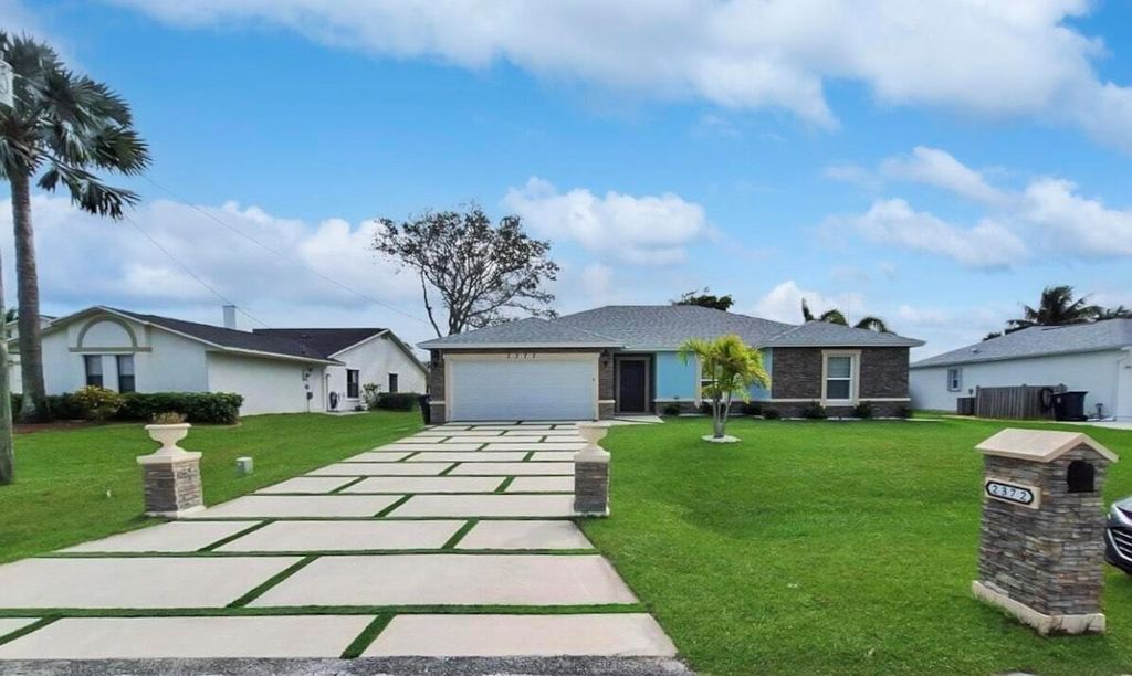 Photo of 2372 SE Maslan Avenue, Port St Lucie, FL 34952 (MLS # R11054637)