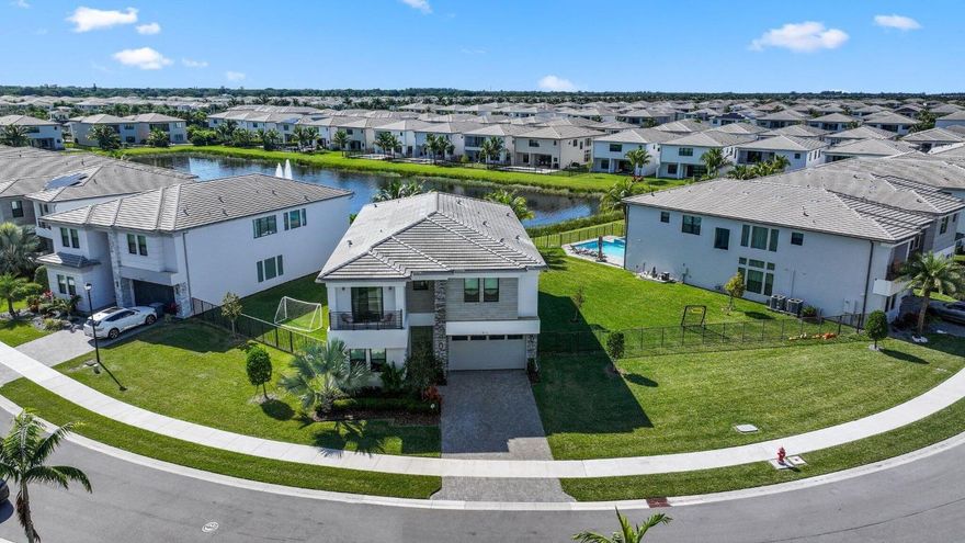 This beautiful Polynesia model sits on a one of a kind lakefront lot with stunning water views. The spacious backyard features a large pool, perfect for relaxing or entertaining. Inside, the home offers 5 bedrooms and 7 bathrooms with plenty of space for everyone. The bright, open kitchen includes a large island, ample cabinet space, and great storage. Upstairs features white oak wood flooring that adds a warm, modern feel. The primary suite includes two separate bathrooms, and a private balcony off a guest bedroom offers a peaceful spot to unwind. Additional highlights include a large laundry room, generous driveway parking, hurricane-impact windows, and a quiet street location. A great opportunity you WON'T want to miss!