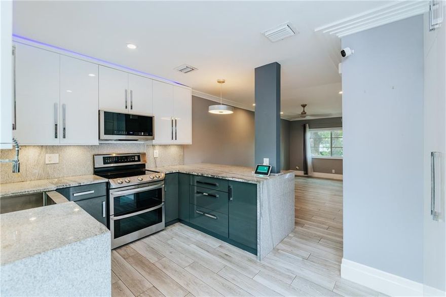 This turnkey contemporary townhome was remodeled in 2017, sparing no detail, touching every wall with sophisticated and desirable upgrades. This home features Italian porcelain plank tiles, marble tile for the entry walkway and back patio, new bathrooms, a new kitchen with a waterfall edge, and built-in cabinetry storage. Enjoy carefree homeownership with all impact windows and doors, tankless water heater, and AC; all were replaced and installed during the 2017 renovations. Manor Grove is centrally located in the heart of Wilton Manors, within walking distance to everything the city offers. This one will not last.