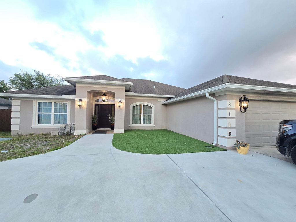 Photo of 3149 SW Crenshaw Street, Port Saint Lucie, FL 34953 (MLS # B26020337)