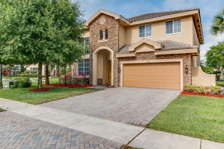 ONE OF THE BEST YARDS IN VERSAILLES! Highly sought-after spacious home with lake view now available in prestigious Versailles of Wellington! Upon entering the elegant gated community you be captivated by the beautifully landscaped gardens, lakes, walking paths and top-notch amenities. This 5 bedroom, 3 bath home offers many upgrades from granite counter tops, gas range, wall oven, raised-panel cabinets, large kitchen island, crown molding, new carpet, screened-in patio and over-sized yard! Enjoy exceptional lake views while entertaining and relaxing! Located in the prestigious community of Versailles in Wellington - 400 homes with top amenities including luxury pool, spa, fitness center, tennis, playground & miles of professionally landscaped walking paths and top schools!