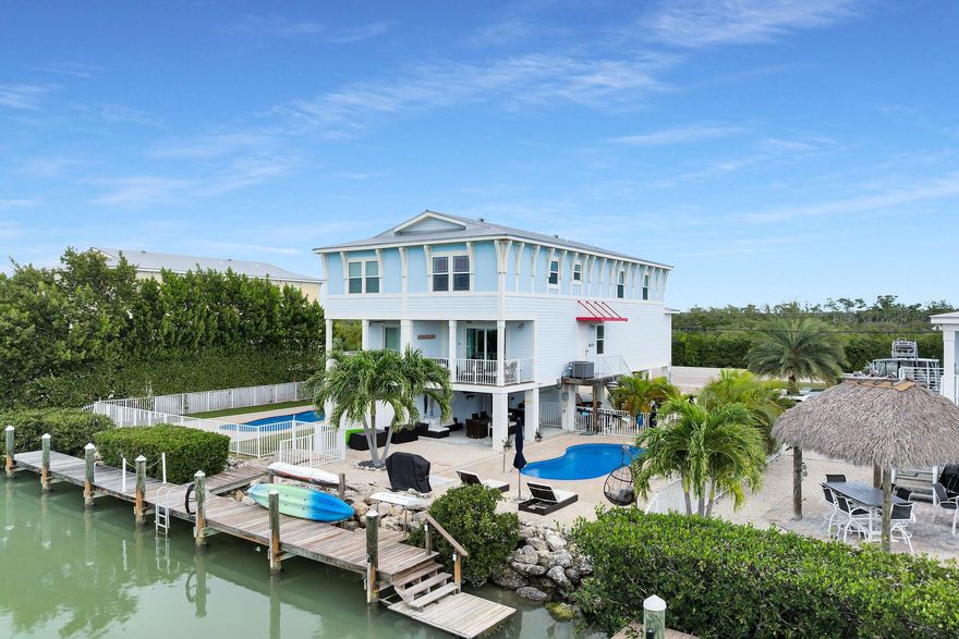 Discover coastal luxury at 219 Sombrero Beach Road 2, a stunning 4-bedroom, 3-bath waterfront retreat just steps from iconic Sombrero Beach, famous for its soft white sand and calm turquoise waters. Set on a 5,471 sq. ft. lot, this 1,840 sq. ft. home blends comfort, privacy, and resort-style living. Enjoy 31 ft. of dockage (Plus exteneded dock, 45 ft seawall total) with ocean access and a private pool with a true cabana feel. Inside, bright open living spaces, spacious bedrooms, and elegant coastal decor create a relaxed, upscale vibe. Ideal as a full-time home, vacation getaway, or high-income rental, this property also offers low insurance costs and an unbeatable location. Minutes from fishing, snorkeling, and open-water adventures, it's the ultimate Florida Keys lifestyle.