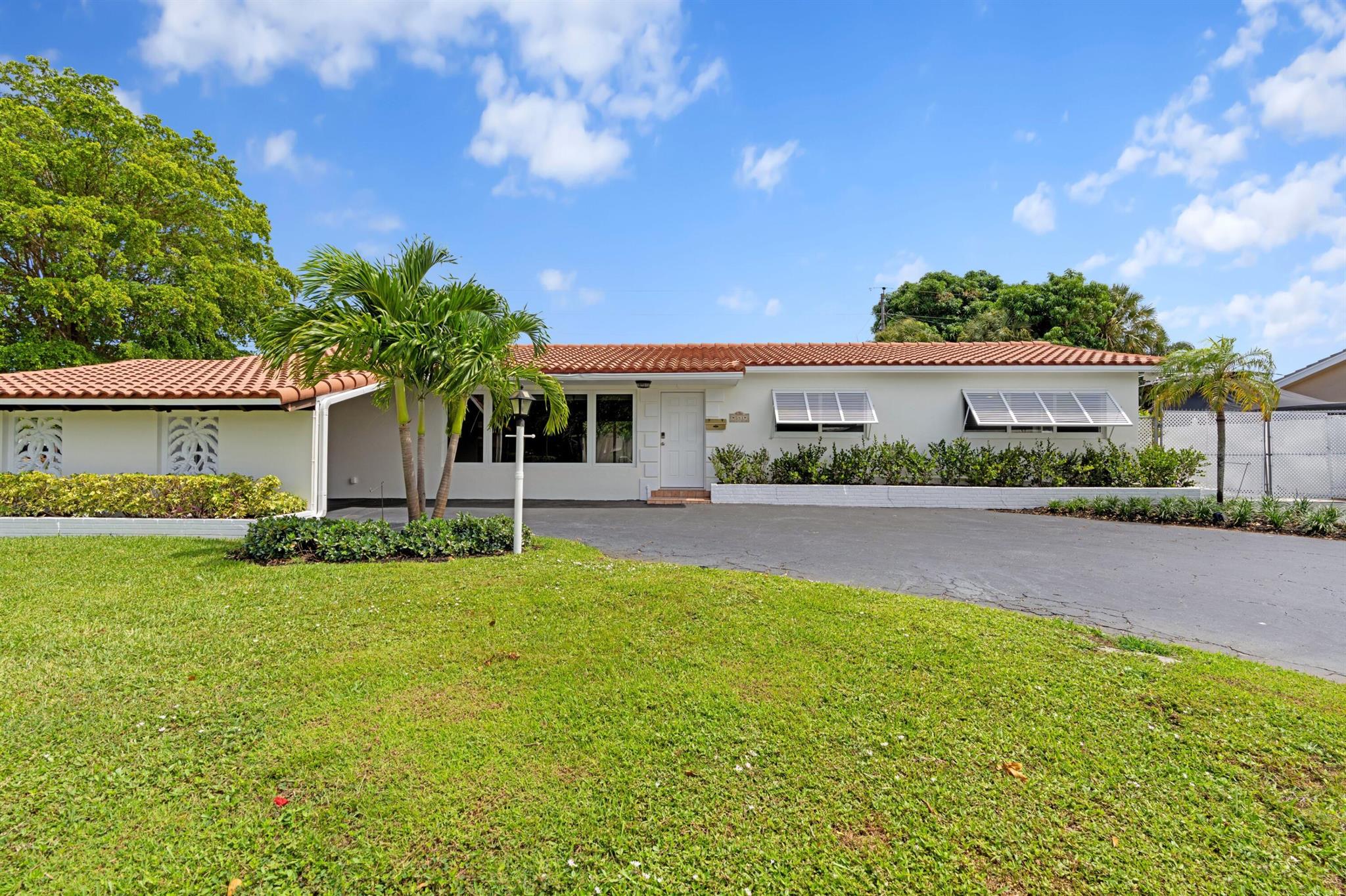 Live Where Others Vacation - North Palm Beach Corner Lot Beauty! Step into timeless elegance blended with modern luxury in this meticulously updated North Palm Beach gem! Originally built in 1958, this residence underwent a complete, high-end renovation--making it move-in ready with all the comforts of today's lifestyle.From the moment you enter, you'll notice the warmth of Mohawk engineered oak wood flooring leading you through the open-concept living space. The gourmet kitchen is a true showpiece--featuring premium Quartz countertops, Dolomite marble backsplash, soft-close cabinetry, and a sleek induction range with built-in air-fry technology. Whether you're hosting dinner parties or a quiet evening in, this kitchen is built to impress. ( Cont'd )