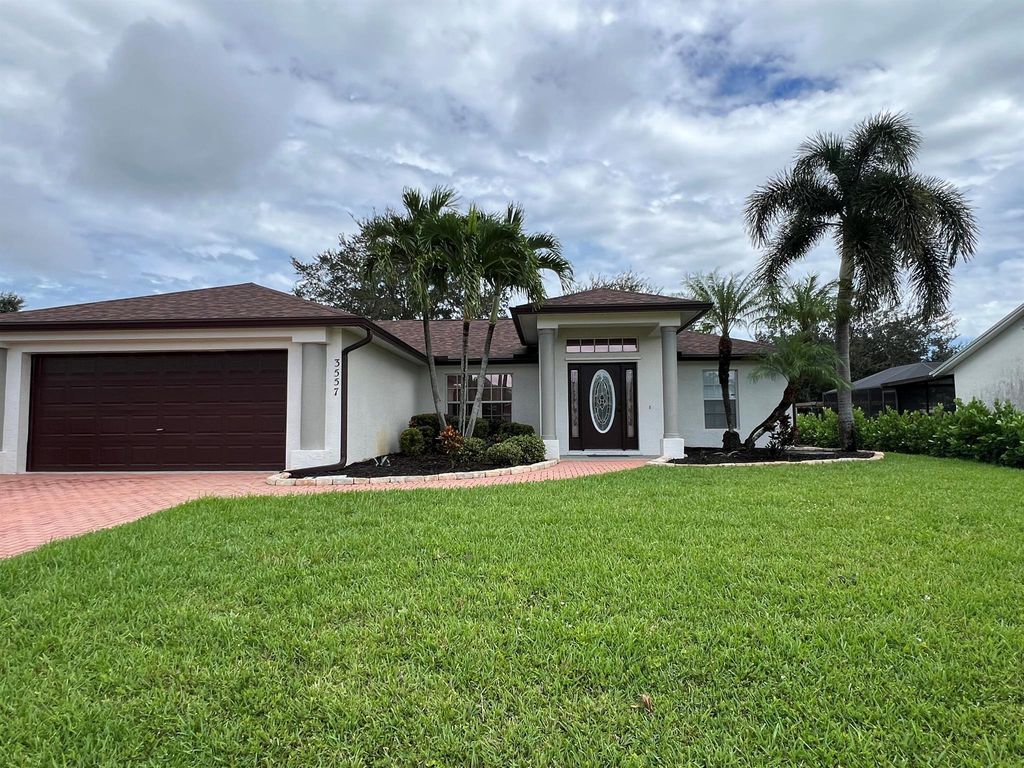Photo of 3557 SW Voyager Street, Port Saint Lucie, FL 34953 (MLS # R11104058)