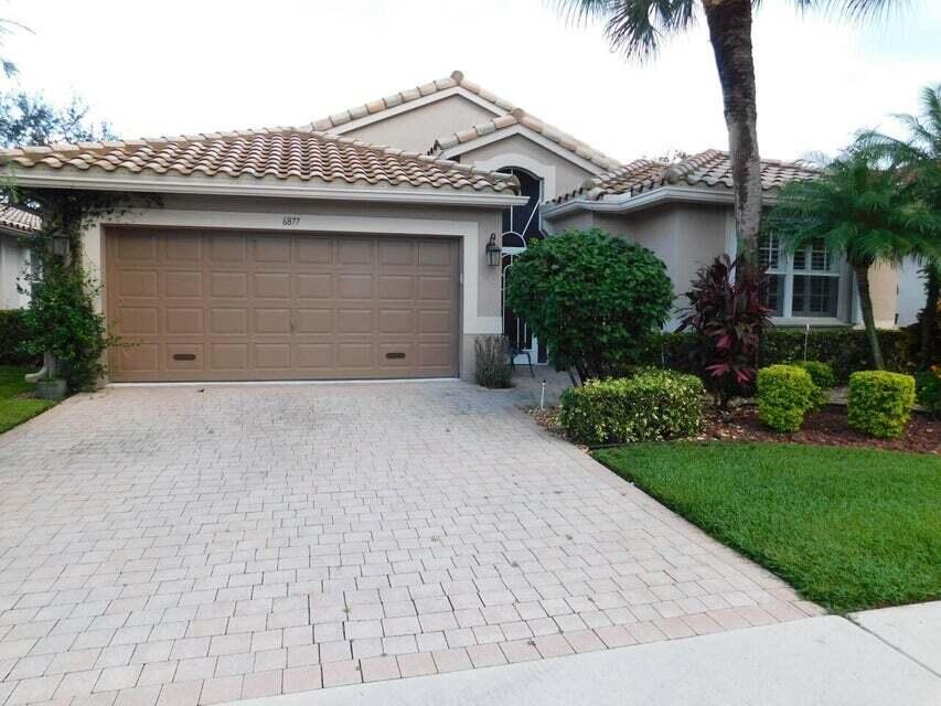 The Cascades of Boynton Beach. Very clean and light/bright home .3 bedroom/2 bath plus family room, and 2 car garage. The home backs up to a canal with plenty of greenery and privacy. Bamboo Wood Floors throughout the main living area of home. Carpeting in the master. Eat-in Kitchen with separate Dining room. Plantation shutters inside, and Hurricane Shutters on all the windows outside. Tiled screened in Patio. This community has a very active clubhouse with all the activities you need. Remodeled clubhouse in 2017. A cafe in the clubhouse. Outside the community, all the dining and shopping you need within minutes.