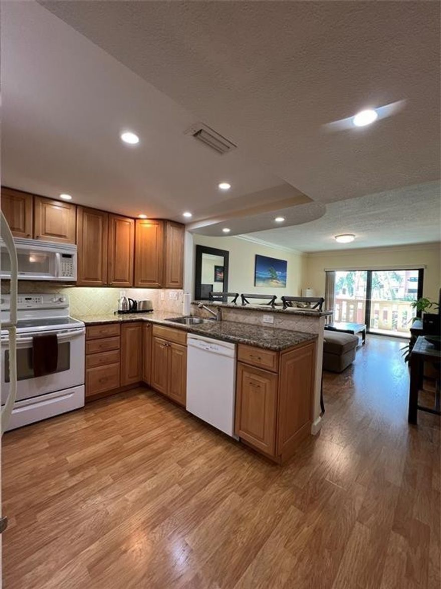 You will love the new look River Reach, a private island community with 24 hour guard house and tons of amenities. It is recently refurbished with all concrete restoration complete, new paint, impact doors, landscaping and balcony railings.  Unit 222 is clean, move in ready and can be sold furnished.  It faces the pool and canal with a covered south facing balcony.  There is a washer and dryer hook up, wood floors throughout and an updated kitchen/bathrooms.  The $737 HOA fee includes water, cable, internet and fully funded reserves.  There is an abundance of amenities inc 3 heated pools, potential dock space, tennis and pickleball, modern gym, kayak racks and more.  2 pets are OK with 20lb each limit.  No lease 1st 2 years.  Perfectly situated near the airport, port, downtown and I95.