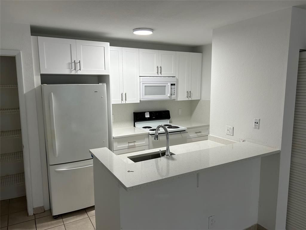 Photo of 1705 Palm Cove Boulevard #1-102, Delray Beach, FL 33445 (MLS # F10501607)