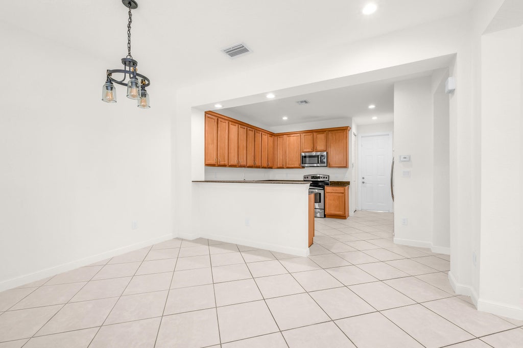Photo of 650 Pacific Grove Drive #5, West Palm Beach, FL 33401 (MLS # B26060193)