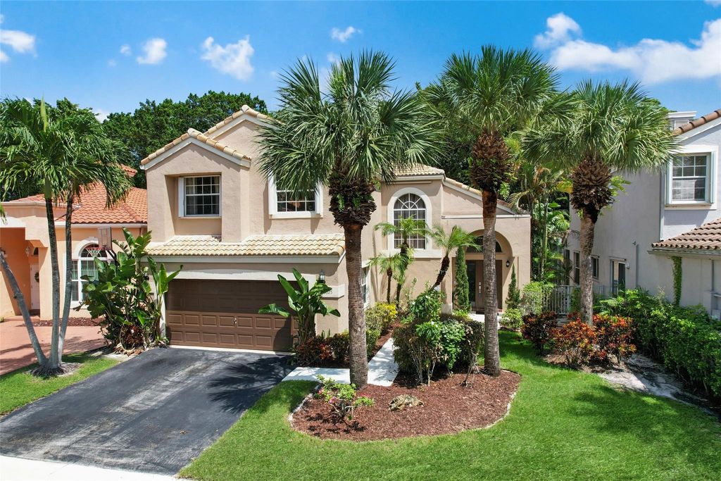 Photo of 6625 NW 75th Place, Parkland, FL 33067 (MLS # B26025386)