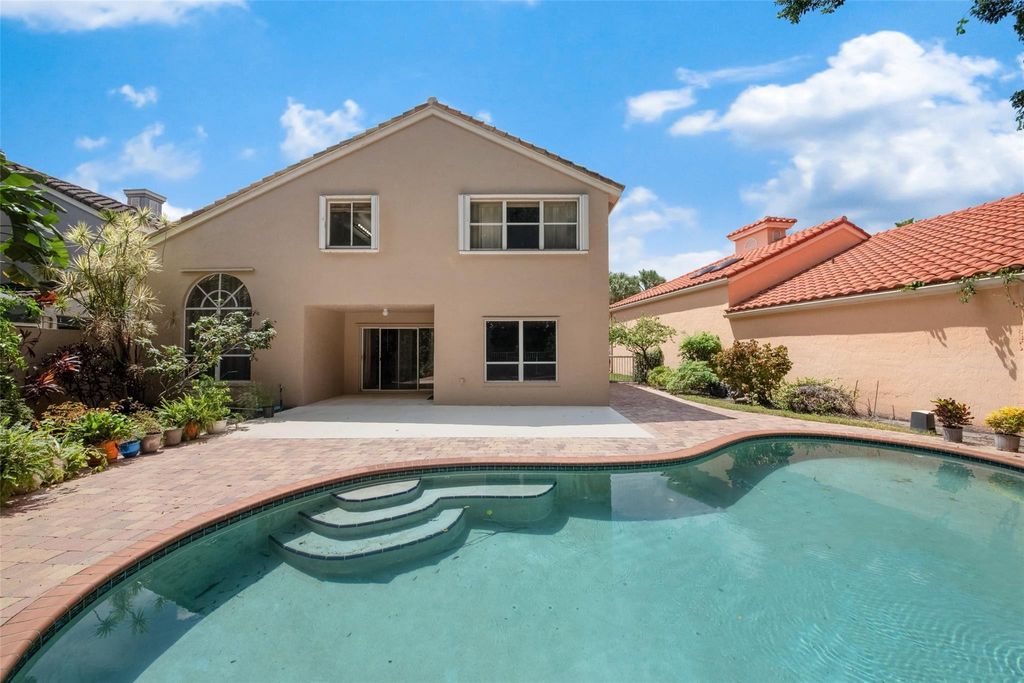 Photo of 6625 NW 75th Place, Parkland, FL 33067 (MLS # B26025386)