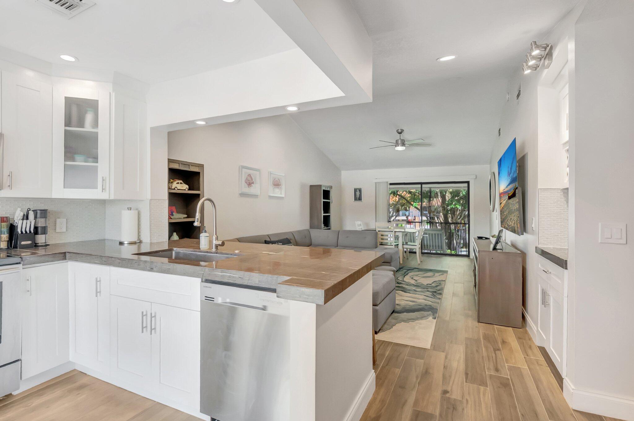 Leased until 06/30/2026.Fully remodeled 2-bedroom, 2-bath condo in the desirable San Remo Golf & Tennis community in East Boca Raton. Minutes to the beach, this home features an open floor plan with a custom wine bar, vaulted ceilings, new window treatments, and built-in closets. The gourmet kitchen offers stainless steel appliances, white shaker cabinets, and elegant countertops. Enjoy wood-look ceramic flooring throughout, including the screened balcony. Spa-like bathrooms with frameless shower doors and marble countertops.Walk to community pool & clubhouse. 2024 AC system. Very convenient location- close to many dining shopping and entertainment options as well as Downtown Boca Raton and Downtown Delray Beach. Cable and internet included!