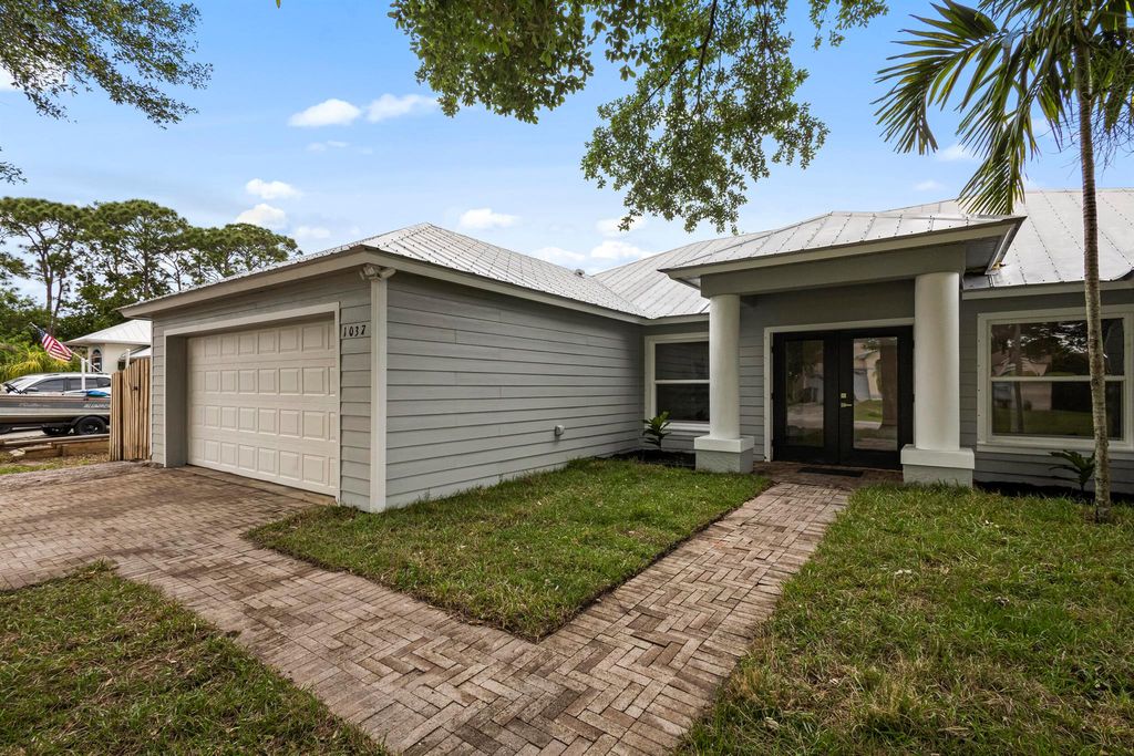 Photo of 1037 SW Majorca Avenue, Port Saint Lucie, FL 34953 (MLS # R10973217)