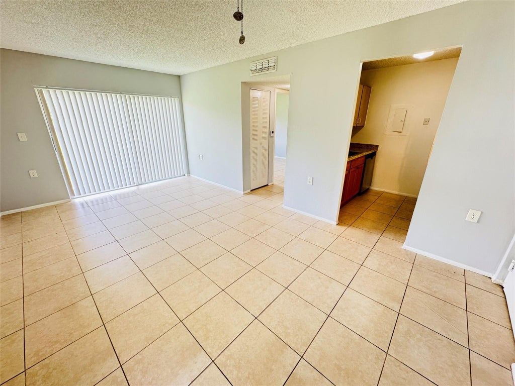 Photo of 1101 N BENOIST FARMS Road #101, West Palm Beach, FL 33411 (MLS # B26070889)