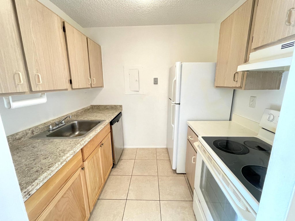 Photo of 1101 N BENOIST FARMS Road #101, West Palm Beach, FL 33411 (MLS # B26070889)