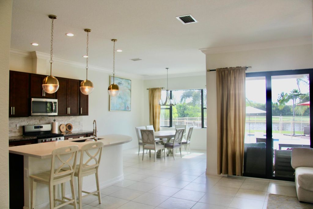 Photo of 8627 Grand Prix Lane, Boynton Beach, FL 33472 (MLS # R11059190)