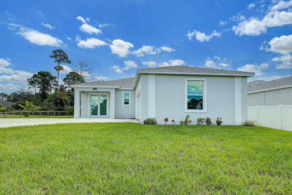 Photo of 1749 SW California Boulevard, Port Saint Lucie, FL 34953 (MLS # R11024677)