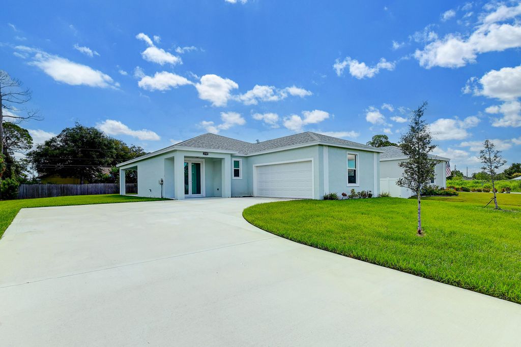 Photo of 1749 SW California Boulevard, Port Saint Lucie, FL 34953 (MLS # R11024677)