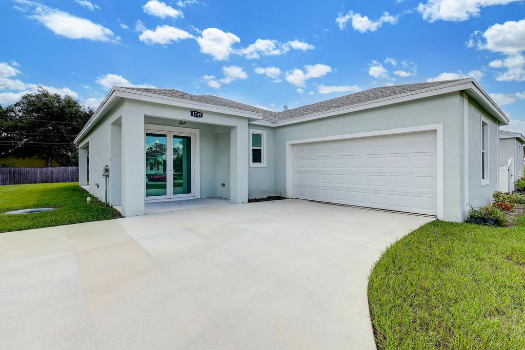 Photo of 1749 SW California Boulevard, Port Saint Lucie, FL 34953 (MLS # R11024677)