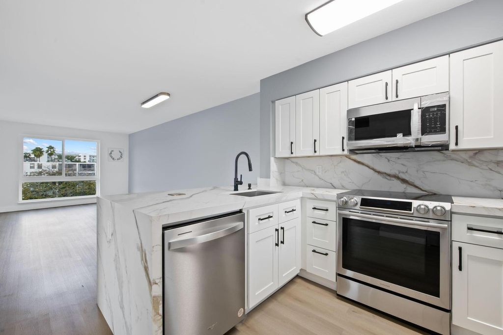 Photo of 2106 S Cypress Bend Drive #501, Pompano Beach, FL 33069 (MLS # B26002193)