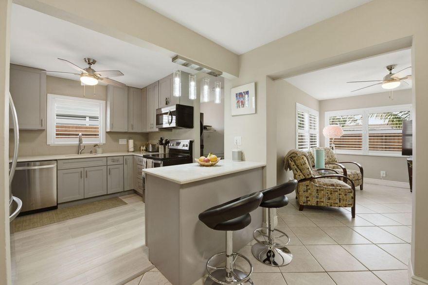 THE BEST PRICED Home in North Andrews Gardens with a Carport, remodeled Kitchen and Bathroom! Charming 2-bed, 1-bath residence offers spacious & functional layout designed for comfort & entertaining. The home features a fully renovated open kitchen with quartz countertops, modern cabinetry, & stainless steel appliances, creating a bright & inviting centerpiece. Laundry area includes an upscale washer & dryer. Versatile family room provides flex space for a home office or studio. Step outside to a large backyard with a covered patio, ideal for relaxing or entertaining, with plenty of room for a pool. Accordion shutters for insurance savings & peace of mind, plus covered carport. Ideally located just minutes from Wilton Manors, Lauderdale-by-the-Sea, shopping, dining, and major roadways.