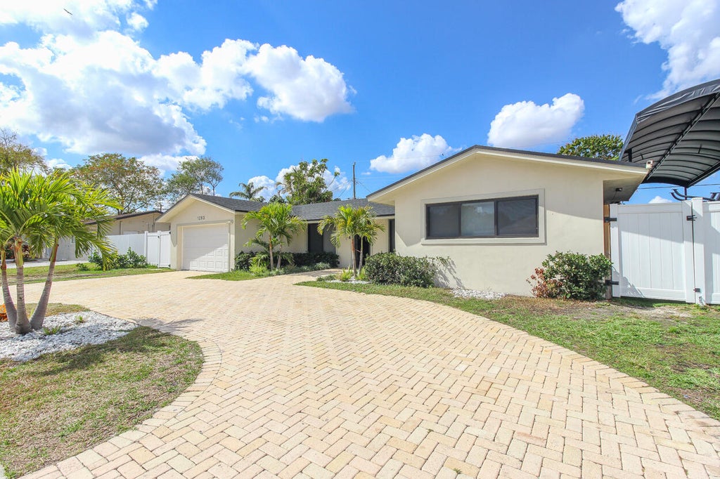 Photo of 1283 Wynnewood Dr, West Palm Beach, FL 33417 (MLS # R11158154)