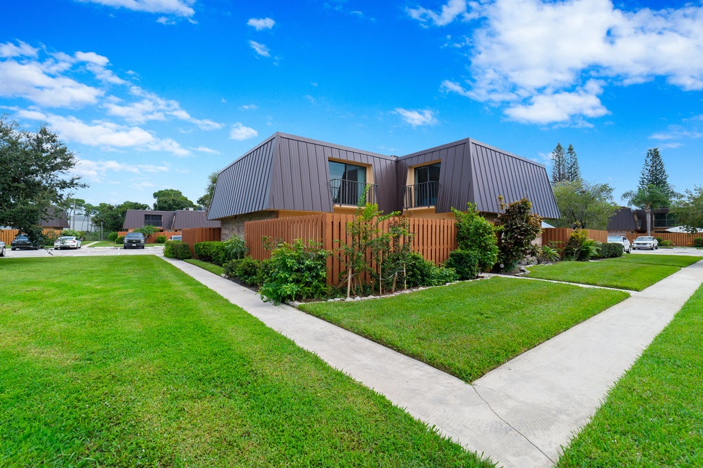 Photo of 5793 SE WINDSONG Lane, Stuart, FL 34997 (MLS # B26078801)