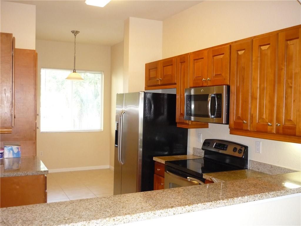 Photo of 3500 Oaks Clubhouse Drive, Pompano Beach, FL 33069 (MLS # B26017476)