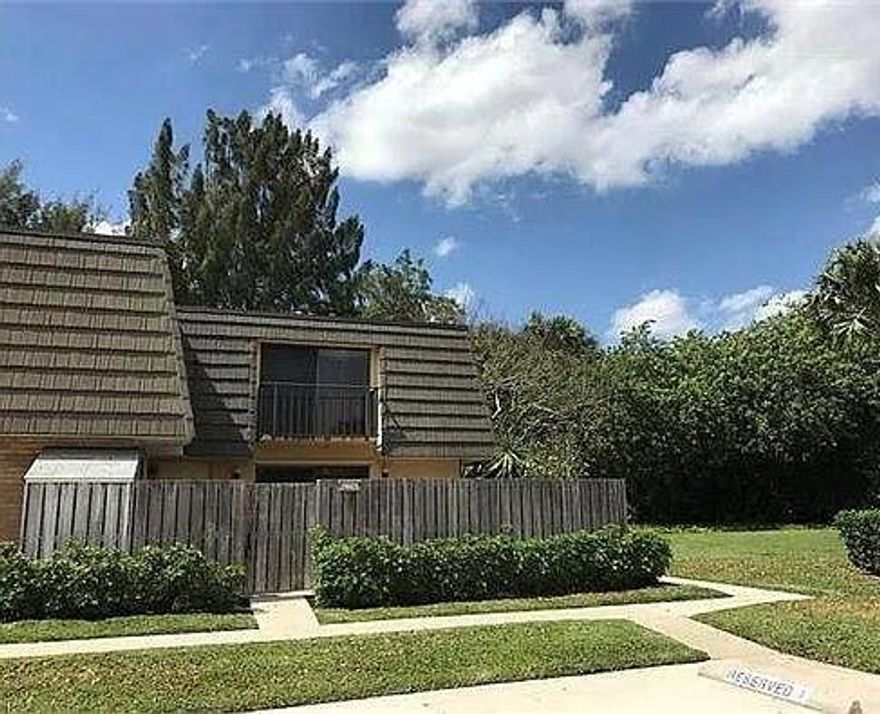 2/2.5 townhome ready for move-in  Includes water and basic cable through HOA. Features tile flooring on the first floor, wood upstairs, new stove, microwave, and dishwasher. Updated kitchen with new countertop, fenced patio, hurricane shutters, washer and dryer. Storage areas inside and outside, balcony off each bedroom, and plenty of closet space. $250 refundable HOA application fee upon approval and move in. Please park in space 4 or 8 only. Community amenities include a pool, kids' play area, tennis courts, and close proximity to I-95, shopping, restaurants, airport, beach, and more. Minimum credit score: 600. RentSpree link: https://apply.link/O8r9rKo. for background check.MUST CALL LISTING AGENT TO SHOW