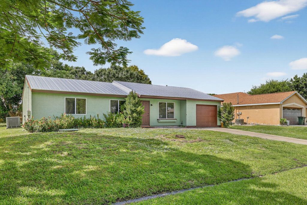 Photo of 2252 SE Aneci Street, Port Saint Lucie, FL 34953 (MLS # R11135940)