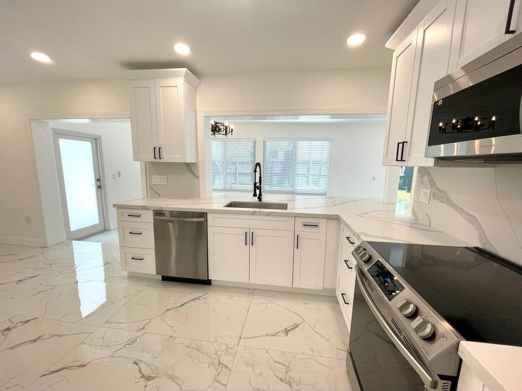 Photo of 861 NW 7th Street, Boca Raton, FL 33486 (MLS # R11118060)