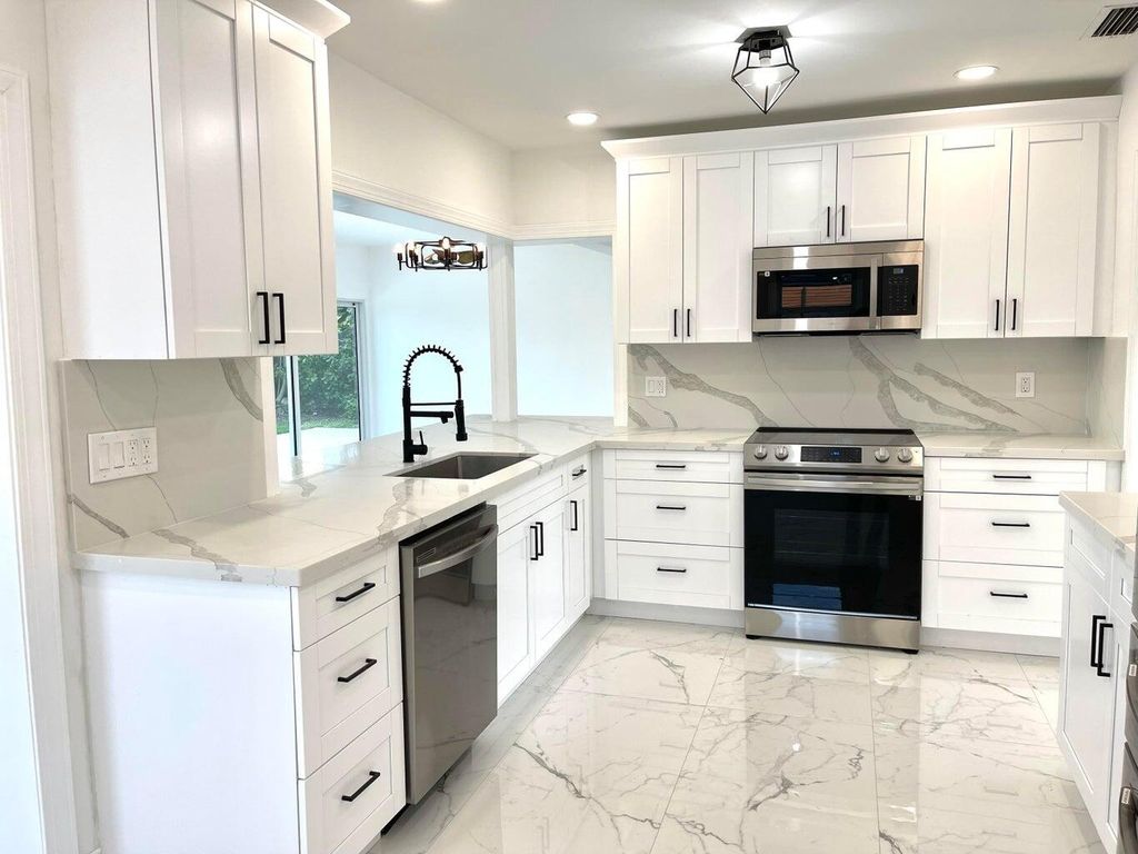 Photo of 861 NW 7th Street, Boca Raton, FL 33486 (MLS # R11118060)