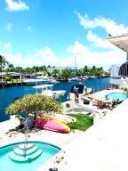 BEAUTIFUL WATERFRONT 1st FLOOR 2/2 APT IN PRISTINE MULTI UNIT BLDG W/POOL AND 20' BOAT DOCKAGE AVAILABLEONLY 1 BLOCK TO MARINA & RESTAURANTS; SPACIOUS & BRIGHT, APPROX 1500SF, WASHER/DRYER, LG WALK-IN CLOSETS FOR LOTS OF STORAGE, LG SCREENED PATIO OVERLOOKS POOL & WATER; LOCATED ON CAP KNIGHT BAYOU FOR CONSTANT PARADE OF BOATS & LIGHTHOUSE VIEWS; THIS QUIET< PRIVATE, IMMACULATELY KEPT BLDG IS A RARE FIND AND READY TO MOVE IN.