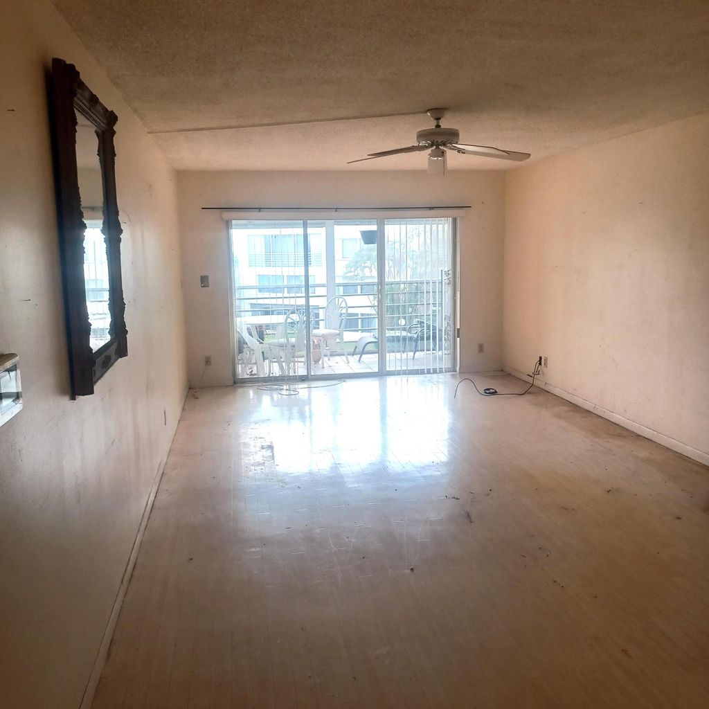 Photo of 3186 Via Poinciana Dr #311, Greenacres, FL 33467 (MLS # B26006295)