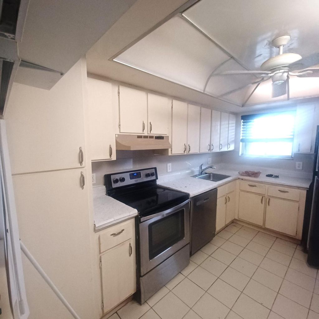 Photo of 3186 Via Poinciana Dr #311, Greenacres, FL 33467 (MLS # B26006295)