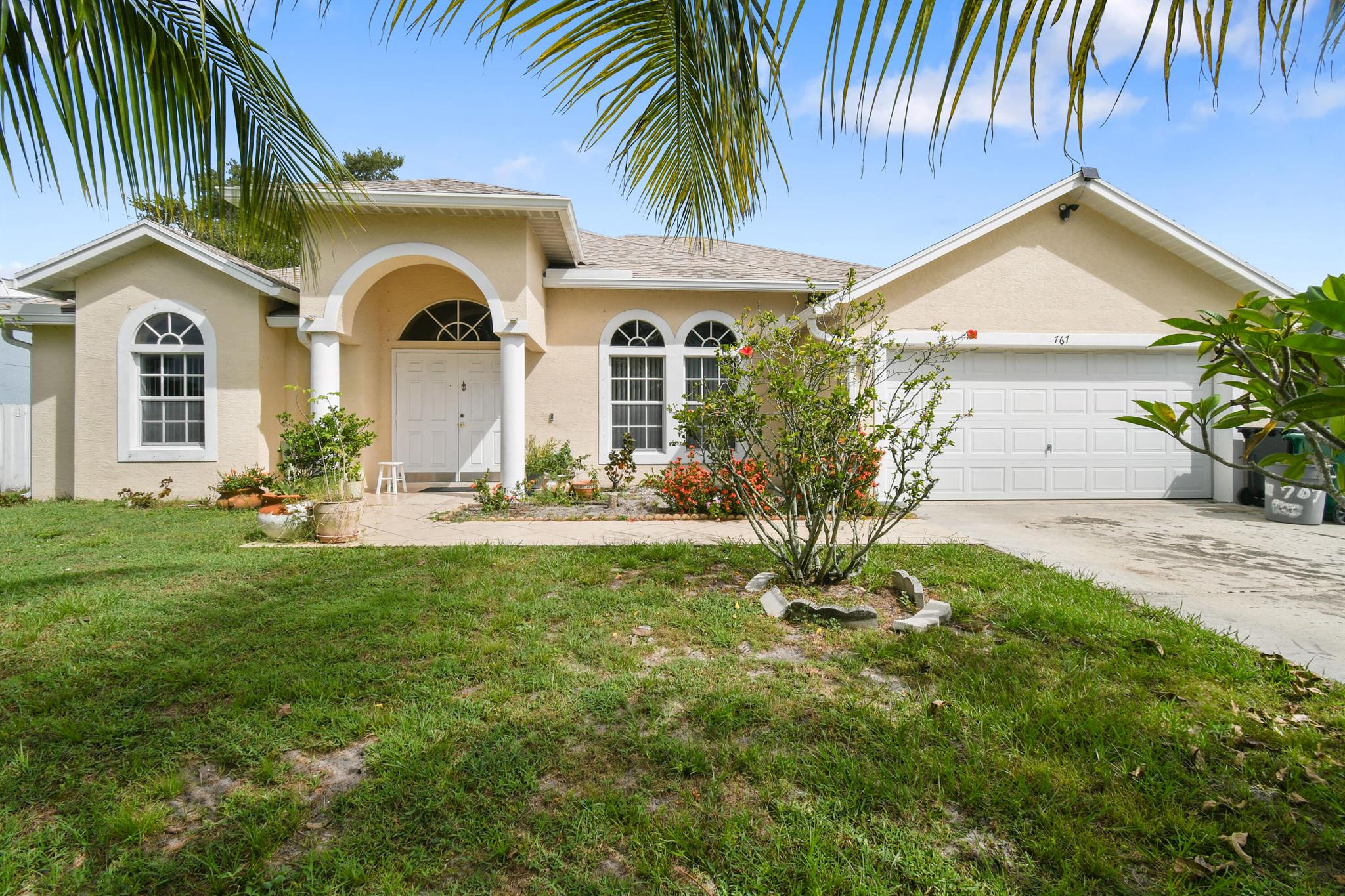 ✨ Welcome to this charming South Port St. Lucie residence, where a grand entrance sets the tone for comfort and style. This thoughtfully designed home features a split floor plan with 3 spacious bedrooms, 2 full baths, and a 2-car garage--perfect for both privacy and functionality.Step inside to discover a bright, open layout with elegant tile flooring throughout. Sliding glass doors in both the living and family rooms lead to a screened-in patio, creating a seamless indoor-outdoor flow ideal for relaxing or entertaining.Additional highlights include an interior laundry room for convenience and a generously sized backyard--partially fenced with several fruit trees and will accommodate a sparkling pool.