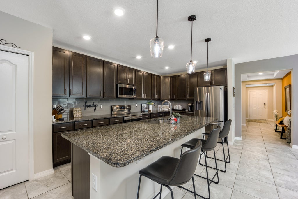 Photo of 5520 NW Thyer Circle, Port Saint Lucie, FL 34983 (MLS # R10943073)