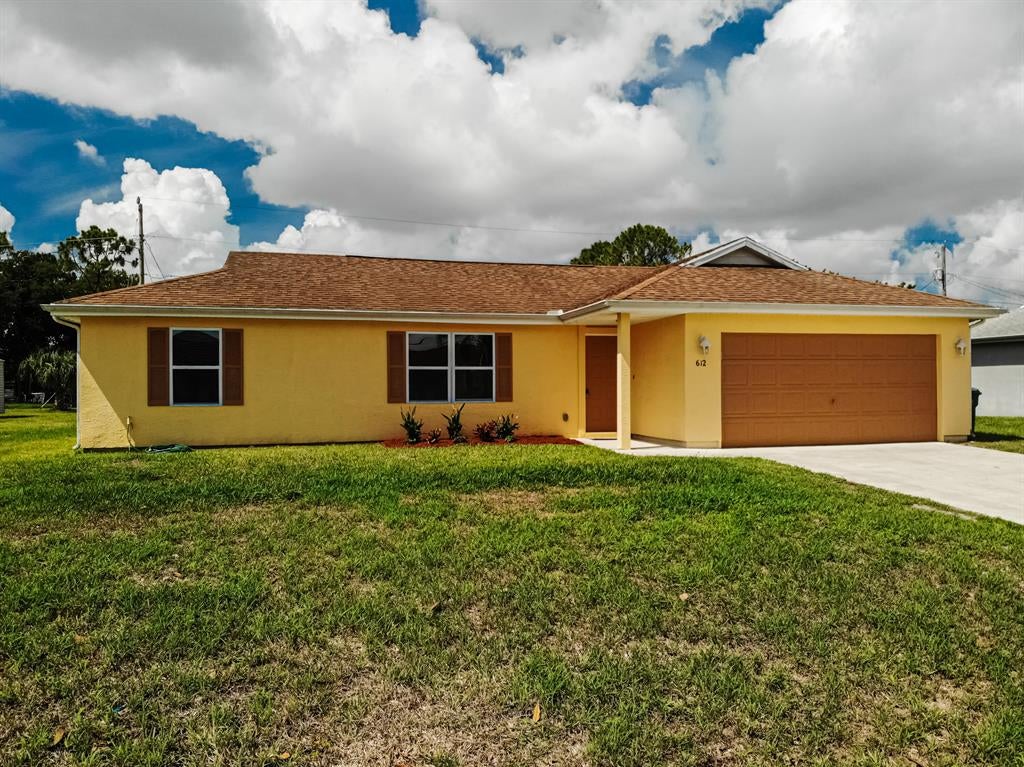 Photo of 612 SW Stillman Avenue, Port Saint Lucie, FL 34953 (MLS # R10722788)