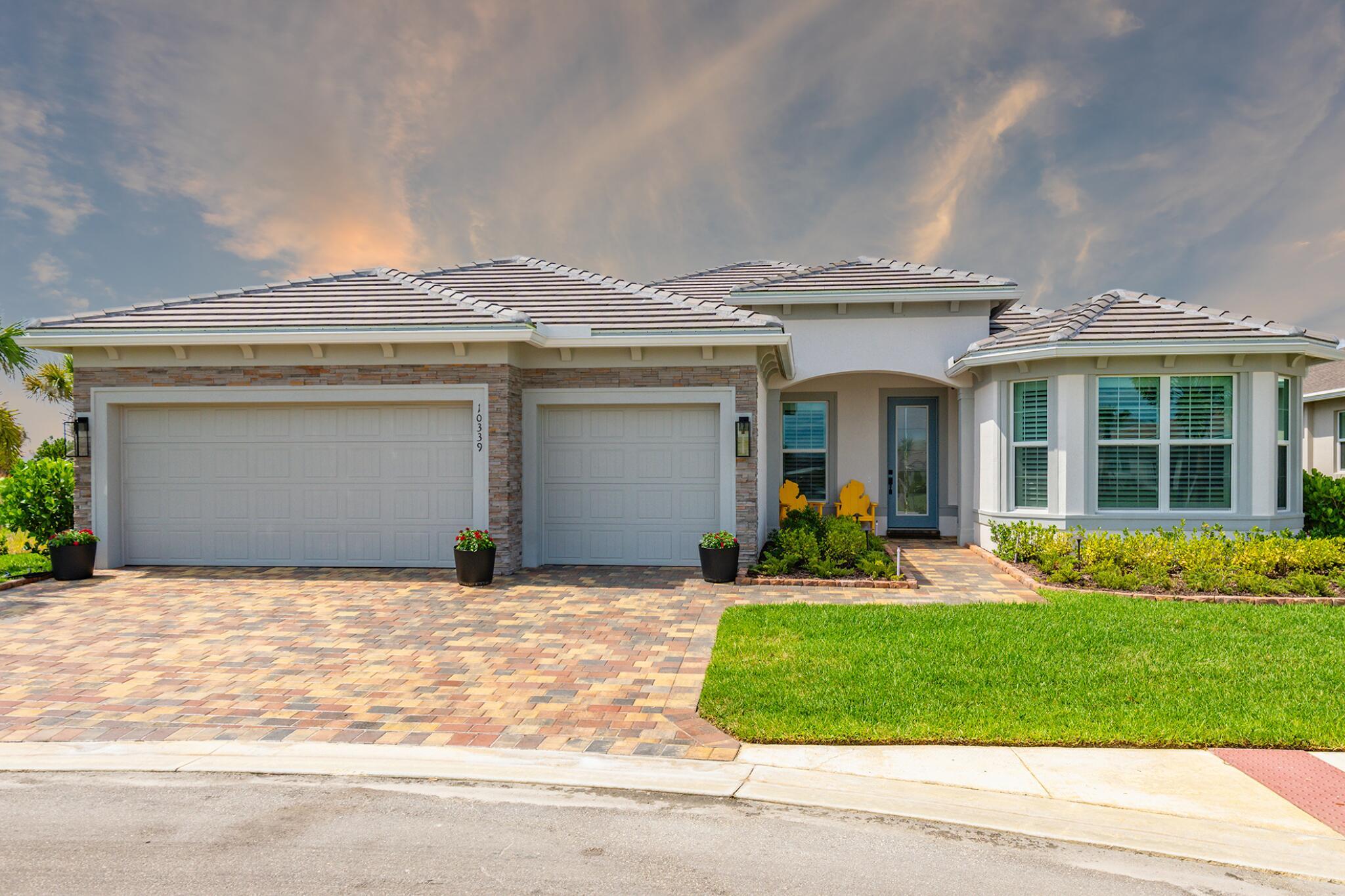 Experience unmatched privacy in this stunning 3 bed, 3 bath + flex room, 3-car garage home built in 2024 in Del Webb at Tradition. Perfectly situated at the end of a cul-de-sac with no neighbors to the left or behind and expansive preserve views, this is the only lot of its kind in the community. Enjoy your private outdoor oasis with a heated pool, spa, sundeck, and full summer kitchen. Inside, find an open layout, soaring ceilings, and designer finishes. This upgraded home offers an open layout, high ceilings, and designer finishes throughout. The gourmet kitchen features quartz counters, soft-close cabinetry, and stainless steel appliances. Relax in the luxurious primary suite with spa-style shower, or entertain in the expansive living area.