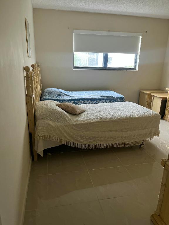 1961 W Woolbright Road D103