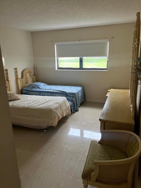 1961 W Woolbright Road D103